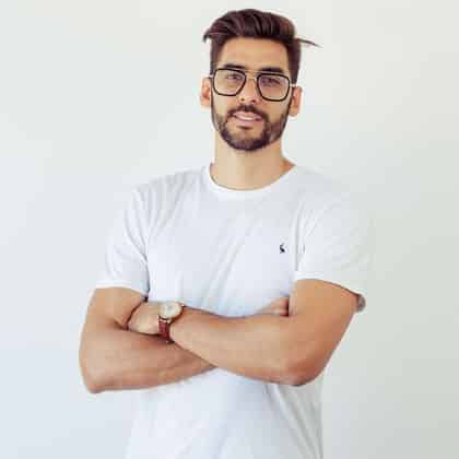 a man with glasses and a white shirt