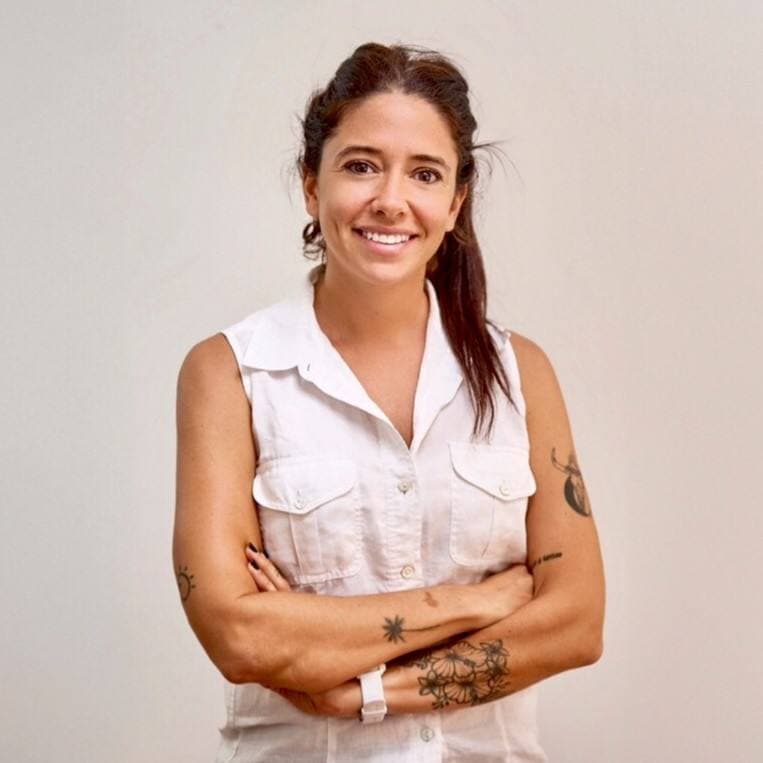 a woman with tattoos on her arms