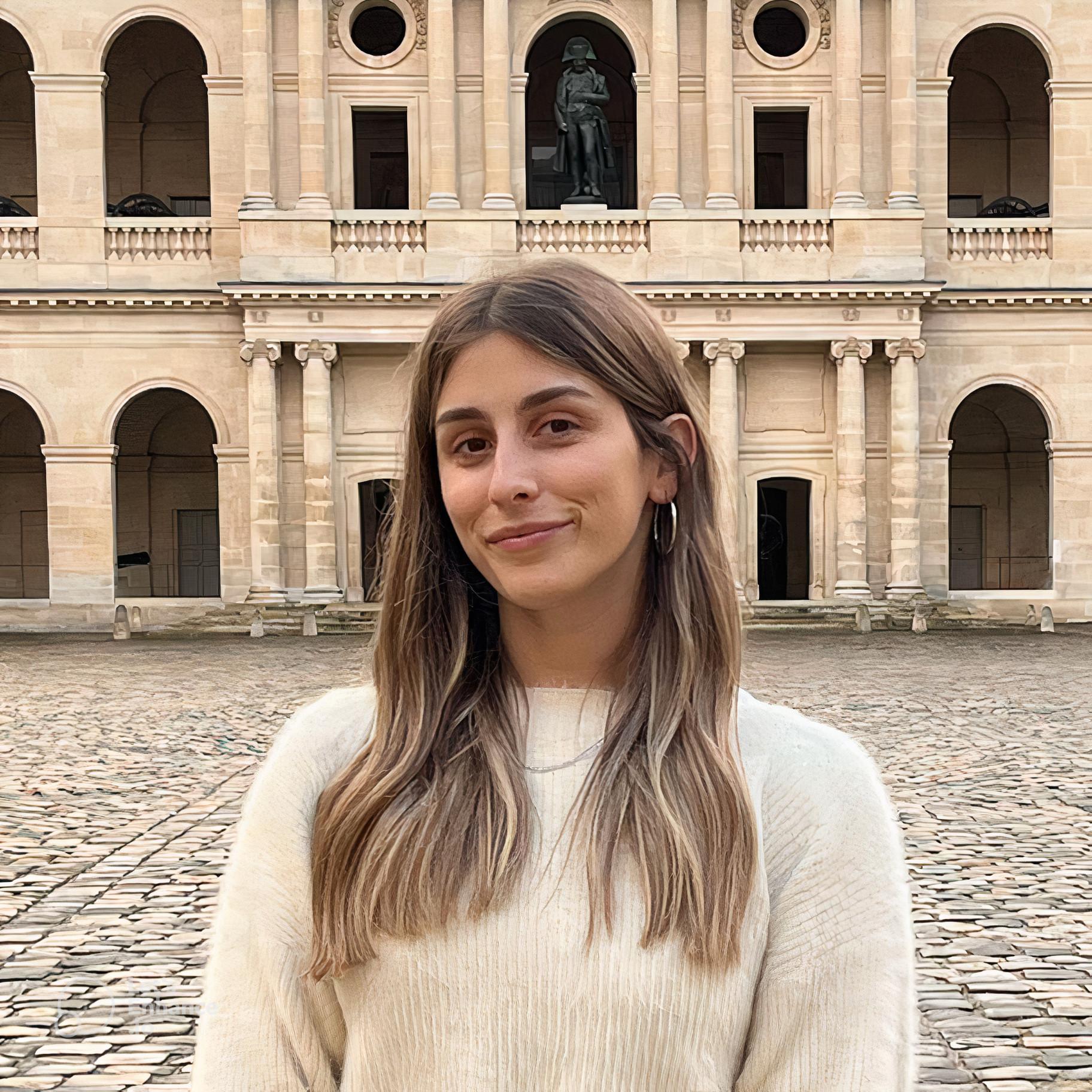 a woman standing in front of a building