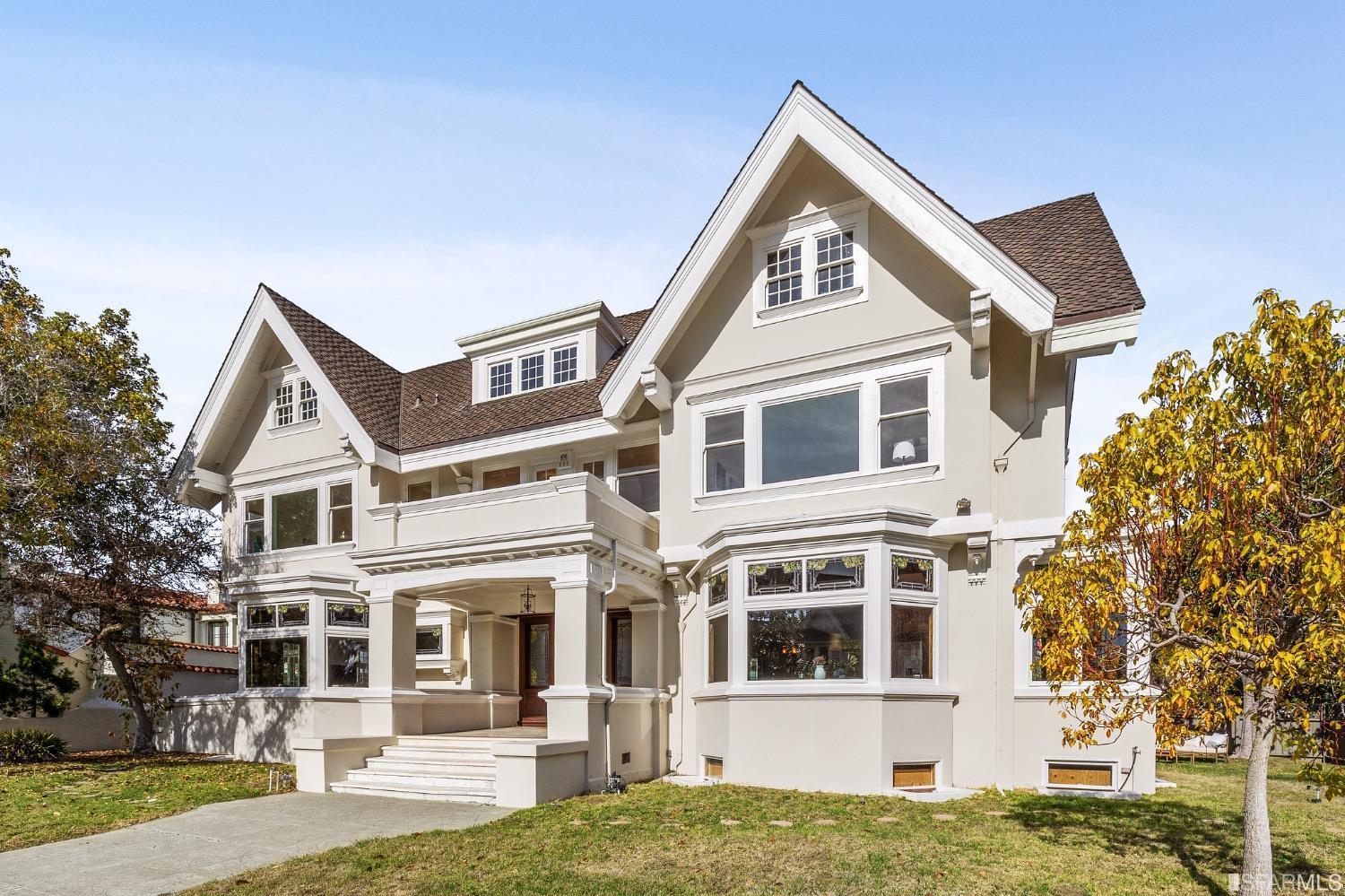 a white house with a large front yard