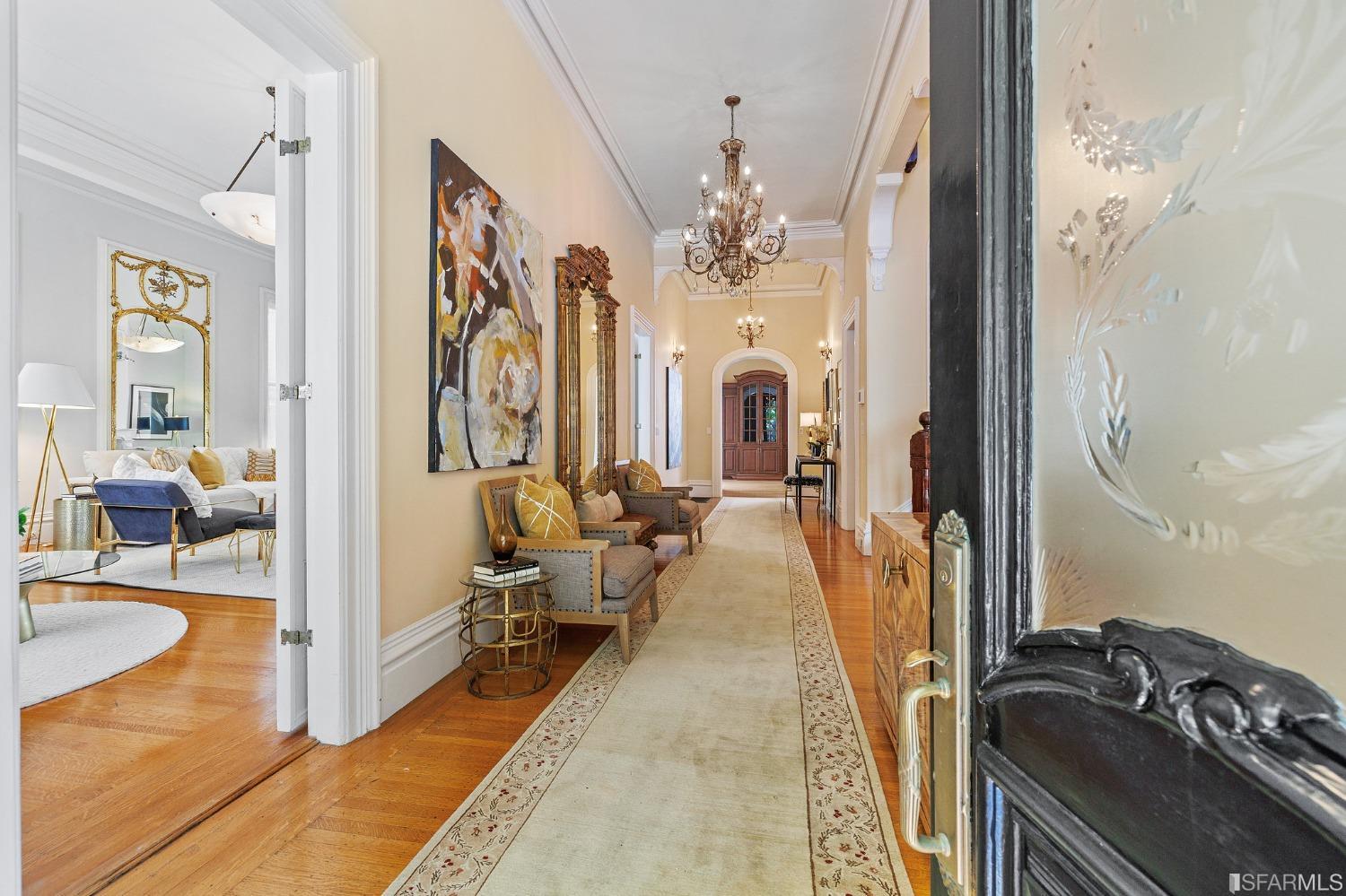 a hallway with a fireplace and a couch