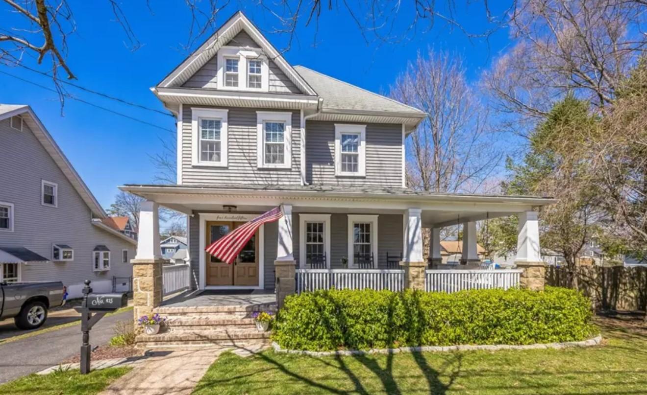 a house with a flag on the front porch